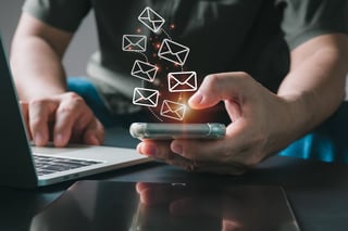 An operator's sign with icons for post-sale services is pointed out by a merchant