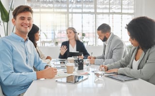 Businessman with notebook and portrait in a meeting