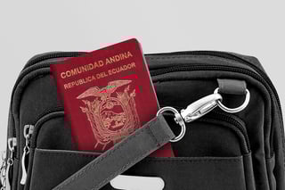 close up of ecuador passport in black travel bag