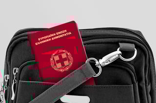 Close up of greece passport in black travel bag pocket