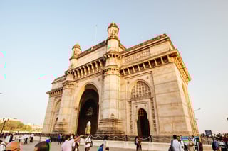 Gateway Of India With Tourists And Sellers On A Clear Autumn Evening