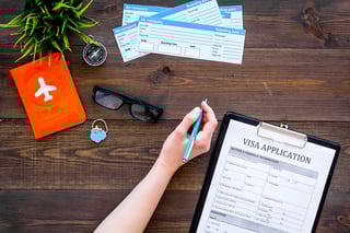 Hand fills visa application form