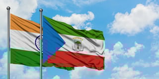 India and equatorial guinea flag waving in the wind against white cloudy blue sky
