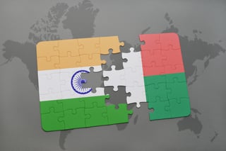 Puzzle With The National Flag Of India And Madagascar On A World Map Background