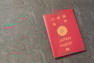 Red Japan passport on surface
