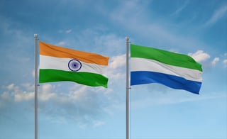 Sierra Leone Or Salone And India Flags Waving Together In The Wind On Blue Cloudy