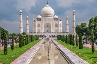 The taj mahal reflecting in the garden ponds