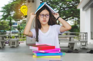 Thinking Idea Student Girl With Glasses And Books On Desk Bored And Tired To Reading Books