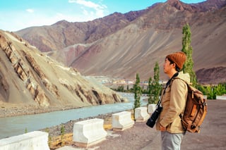 Travel Photographer With Dslr Camera And Big Lens In Mountain Scene Leh India